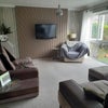 Photo 4: Bright living room overlooking a small green