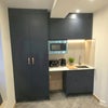 Photo 2: Private kitchenette / Sink / Storage cabinets / Microwave / Fitted wardrobe / Hanging rails and shel