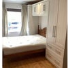 Photo 3: B1 -  Built in wardrobes, 2 seat sofa, basin, stripped wood floors
