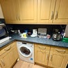 Photo 3: Kitchen and washer/dryer