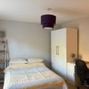 Photo 2: Double bed, desk and chair, wardrobe with drawers, shelf unit
