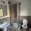 Photo 3: En suite shower, toilet, sink and towel radiator