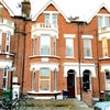 Photo 5: Front of the house (lovely red brick building)