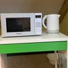 Photo 7: microwave and kettle in room