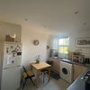 Photo 2: Fully equipped kitchen with space for dining