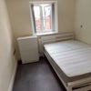 Photo 1: Bed, mattress and small cupboard