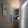 Photo 9: Hall way showing door on left to shower room