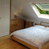 Photo 1: Loft bedroom with view over woodland