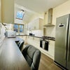 Photo 3: Large spacious kitchen with allocated space per tenant. 