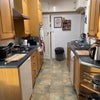 Photo 9: Shared kitchen, with washing machine and freezer in utillity room