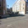Photo 5: View of Apartment Building