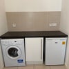 Photo 4: Utility area with freezer, washing machine and drying area