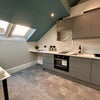 Photo 12: Kitchen and bar area