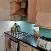 Photo 5: Kitchen w. oven & gas hob, kettle and toaster