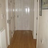 Photo 7: Hallway: room to rent is at the end; bathroom and kitchen to the left; lounge to the right