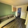 Photo 5: Communal area- Smart Tv and sofa provided