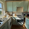 Photo 3: Kitchen with gas stove (!), plenty of storage cupboard, laundry machine & mini fridge
