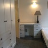 Photo 3: En suite bedroom with 3 door wardrobe and chest of drawers, desk and computer chair