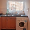 Photo 6: Kitchen with Washing Machine