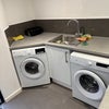 Photo 2: Utility room with two washing machines, drying facilities and additional freezer