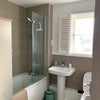 Photo 9: Main upstairs bathroom with utility cupboard