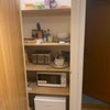 Photo 6: cooking cupboard (fridge, m/wave, toaster, utensils)