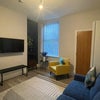 Photo 1: Spacious and modern shared living room with seating area