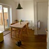 Photo 8: Dining table and patio doors to garden. Under stairs cupboard on the right for hoover/ mop etc