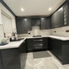 Photo 5: Our space- efficient kitchen comes fully fitted with modern utilities. It’s bright, clean & cozy