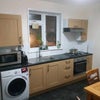 Photo 3: Kitchen with washer dryer