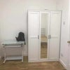 Photo 3: Wardrobe and desk