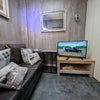 Photo 8: Sofa tv and soft furnishings