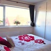 Photo 1: Large double bed & built-in wardrobes.
