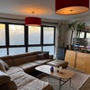 Photo 1: Open plan lounge/ breakfast bar/ kitchen overlooking the river 