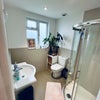 Photo 2: Ensuite bathroom including sink basin with storage and walk-in shower 