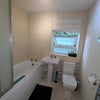 Photo 3: Clean, shared bathroom with shower over bath
