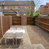 Photo 8: Garden with outdoor table and secure bike parking