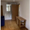 Photo 4: B1 -  Built in wardrobes, 2 seat sofa, basin, stripped wood floors