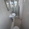 Photo 6: Toilet and standing shower 