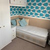 Photo 4: Room with bed and cupboards 