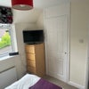 Photo 9: Bedroom 2. Tv and Storage 