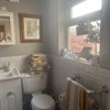 Photo 9: Toilet in bathroom with heated tiled floor 