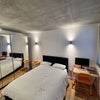 Photo 4: King size bed. The Desk and side table can go if not needed.