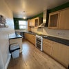 Photo 4: Kitchen with ample cabinet & utilities