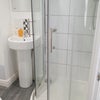 Photo 6: Thermostatic shower and heated towel rail comes standard