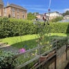Photo 8: Private back garden with patio and secure storeroom for bikes.