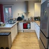 Photo 5: Opem plam kitchen with dishwasher snd american fridge freezer