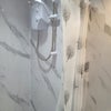 Photo 4: Walk in shower which is electric 