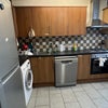 Photo 3: Kitchen with big fridge, TV, dishwasher, washing machine + dryer