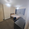 Photo 1: Room 1 - Double Bed, Desk and Storage